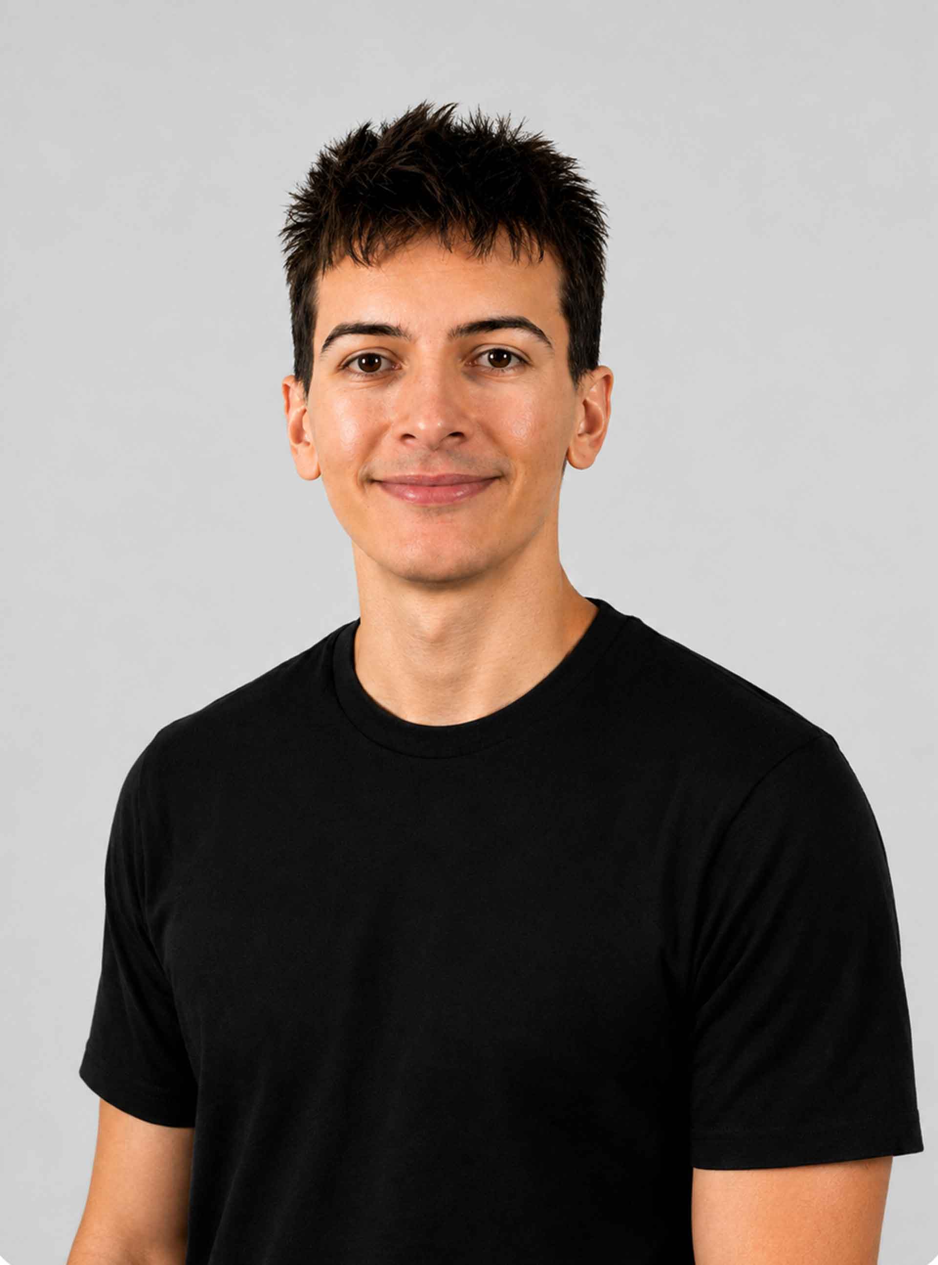 Alexander Zito, head-and-shoulders portrait against a light grey background.